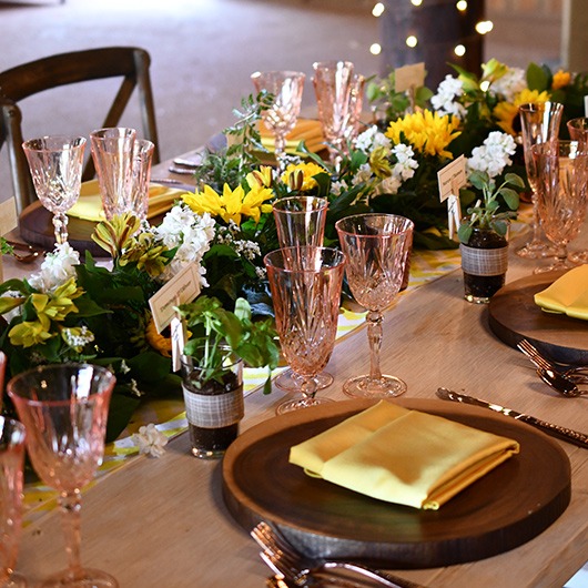 floral garland with sunflowers and white stock for reception table