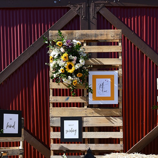 floral spray on a wood pallet