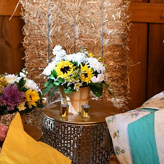 flower basket on side table at reception