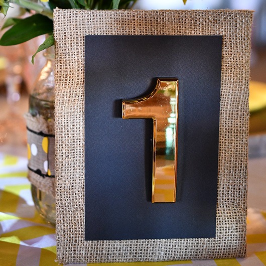 gold table number with burlap