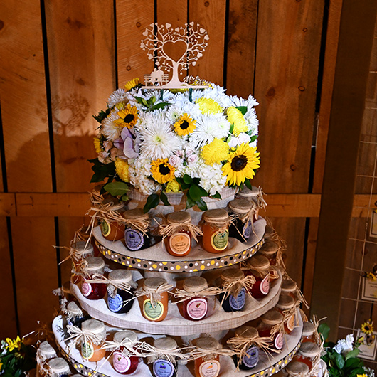 wedding cake floral topper with daisies and sunflowers
